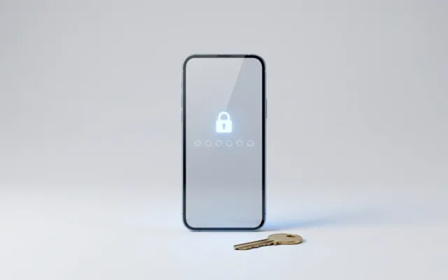 Celular em estúdio com campos de PIN e cadeado na tela, e uma chave ao lado